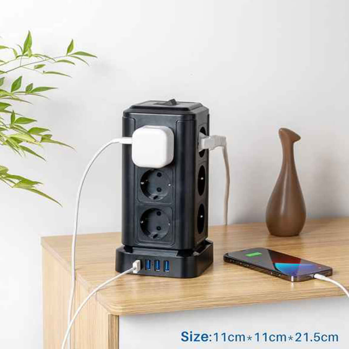 TP-VF4U12E-C Tower power strip with 12 sockets, 3 USB-A, and 1 USB-C on a desk.